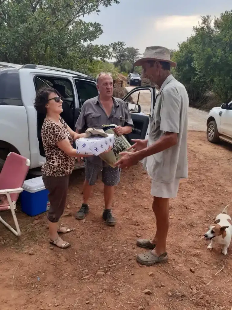 CNS handing out work boots for needy helpers.